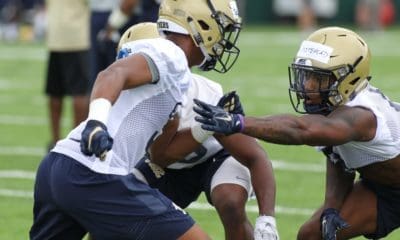 Jordan Whitehead works with other DB during the first practice of the season (Photo credit: David Hague)