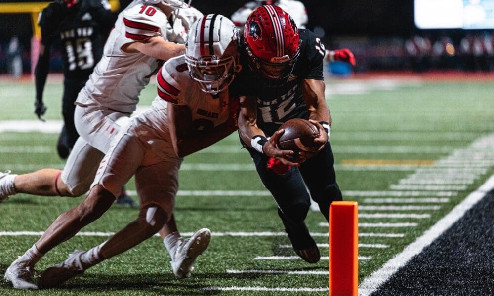Imhotep Charter quarterback Mikal Davis dives for the pylon in the 5A PIAA State Championship against Peters Township. Photo by Eddie Provident.