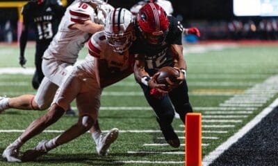 Imhotep Charter quarterback Mikal Davis dives for the pylon in the 5A PIAA State Championship against Peters Township. Photo by Eddie Provident.