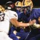 Elizabeth Forward defensive end Charlie Meehleib (53) rushes the passer against West Mifflin left tackle Rico Steele (79).