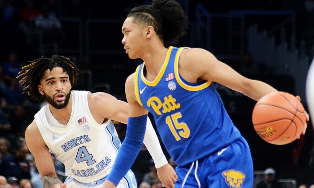 Pitt guard Jaland Lowe drives by UNC guard RJ Davis in the ACC Tournament semifinals on Friday, March 15, 2024 at Capital One Arena in Washington, D.C. (Mitchell Northam / Pittsburgh Sports Now)